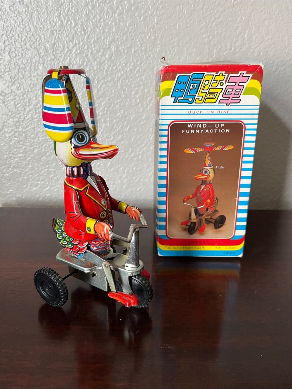 Vintage Wind-Up Duck on Bike Toy - Red